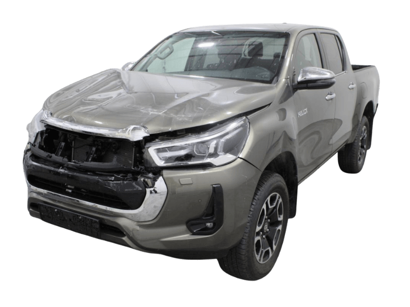 Damaged Toyota Hilux pickup truck marked for salvage car removal in Auckland with dollar symbol